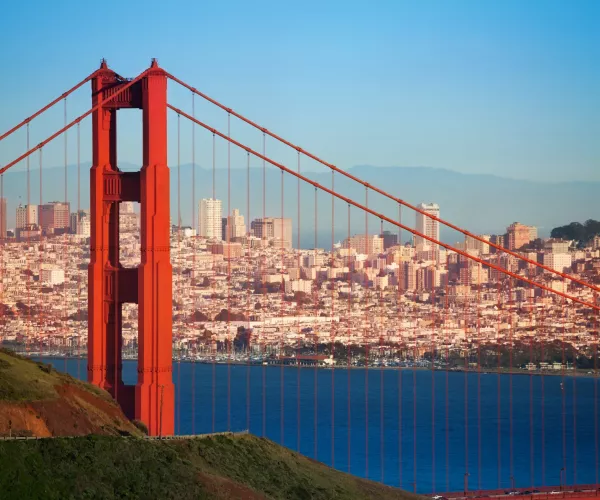Beautiful cityscape of San Francisco and famous Golden Gate Bridge at sunny day, USA