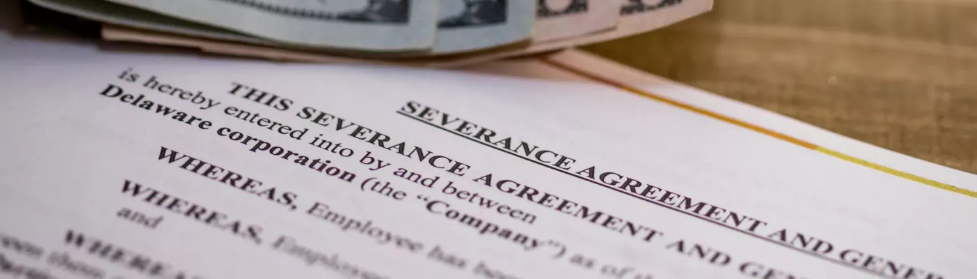 Severance Pay concept with agreement document on wooden board